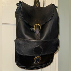 Front pocket black leather back pack